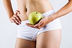 Beautiful Young Woman In White Underwear Holding Green Apple Stock Photo