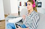 Beautiful Young Woman Listening To Music With Digital Tablet Stock Photo