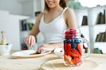 Beautiful Young Woman Preparing Breakfast At Home Stock Photo
