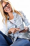Beautiful Young Woman Sitting At Home With Digital Tablet Stock Photo