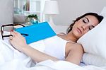 Beautiful Young Woman Sleeping After Read A Book Stock Photo
