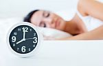 Beautiful Young Woman Sleeping In Bed Trying To Wake Up With Ala Stock Photo