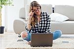Beautiful Young Woman Using Her Laptop At Home Stock Photo