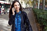 Beautiful Young Woman Using Her Mobile Phone In The Street Stock Photo