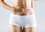 Beautiful Young Woman With Hands On Belly-stomach Ache Stock Photo