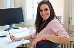 Beautiful Young Woman Working In Her Office Stock Photo