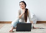 Beautiful Young Woman Working On Her Laptop At Home Stock Photo