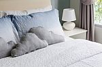 Bed And Pillows With White Lamp Stock Photo