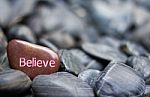 Believe Word On Engraved Stone Stock Photo