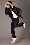 Black Acrobat Man Dancing In Studio Stock Photo
