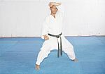 Black Belt Karate Man In Defending Position Stock Photo