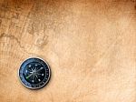 Black Compass On Brown Paper Stock Photo