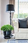 Black Pillows On Classical Style Sofa With Black Lamp Stock Photo