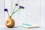 Blank Notebook With Flower On White Wooden Table Stock Photo