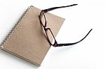 Blank Page Of A Notebook And Eyeglasses Stock Photo
