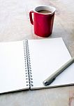 Blank Page Of A Spiral Notebook And Coffee Cup Stock Photo