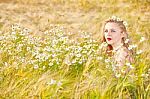 Blond Girl On The Camomile Field Stock Photo