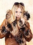 Blond Woman With Fur Coat Stock Photo