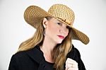 Blonde Female In Large Hat And Black Coat Stock Photo