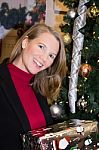 Blonde Female Looking At Camera Holding Presents Stock Photo