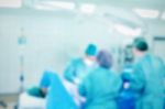 Blurred Background With Team Surgeon At Work In Operating Room Stock Photo
