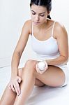 Body Care. Woman Applying Cream On Legs Stock Photo