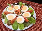 Boiled Egg Yolk With Tomato And Lettuce Served With Fish And Chili Sauce Stock Photo
