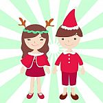 Boy And Girl In Santa Claus Costume Stock Photo