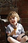 Boy Enjoying An Ice Cream Stock Photo