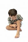 Boy Scratching Leg Stock Photo