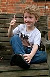 Boy With Thumbs Up, Missing Some Teeth Stock Photo