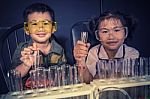 Brother And Sister Studying In School Science Research Laboratory Stock Photo