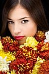 Brunette Woman Behind Flowers Stock Photo