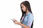 Brunette Woman Typing On Her New Electronic Tablet Touch Pad Com Stock Photo