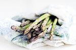 Bunch Of Fresh Asparagus In A Kitchen Cloth Stock Photo