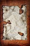 Burned Paper With Wooden Board Stock Photo
