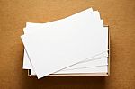 Business Card On Kraft Cardboard Stock Photo