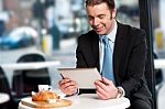Business Executive At Open Restaurant Stock Photo