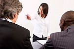 Business Lady Fighting At Meeting Stock Photo