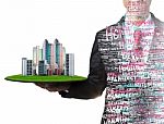 Business Man And Real Estate In Hand Stock Photo