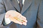 Business Man Holding Gold Stock Photo