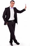 Business Man Standing Against Wall Stock Photo