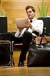 Business Man Waiting With Ipad Stock Photo