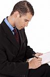 Business Man With Notepad Stock Photo