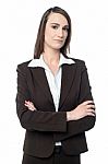 Business Manager Posing With Her Arms Crossed Stock Photo