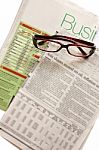 Business News Paper With Glasses Stock Photo
