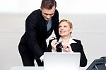 Business People At Work. Male Pointing At Laptop Stock Photo