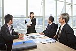 Business People Report Meeting In Office Stock Photo