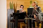 Business People With Phone And Ipad Stock Photo