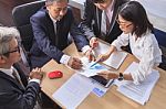 Business  Team Work Asian People Report Analysis  Meeting Discussing Project Planing Shot Over Office Working Table Stock Photo